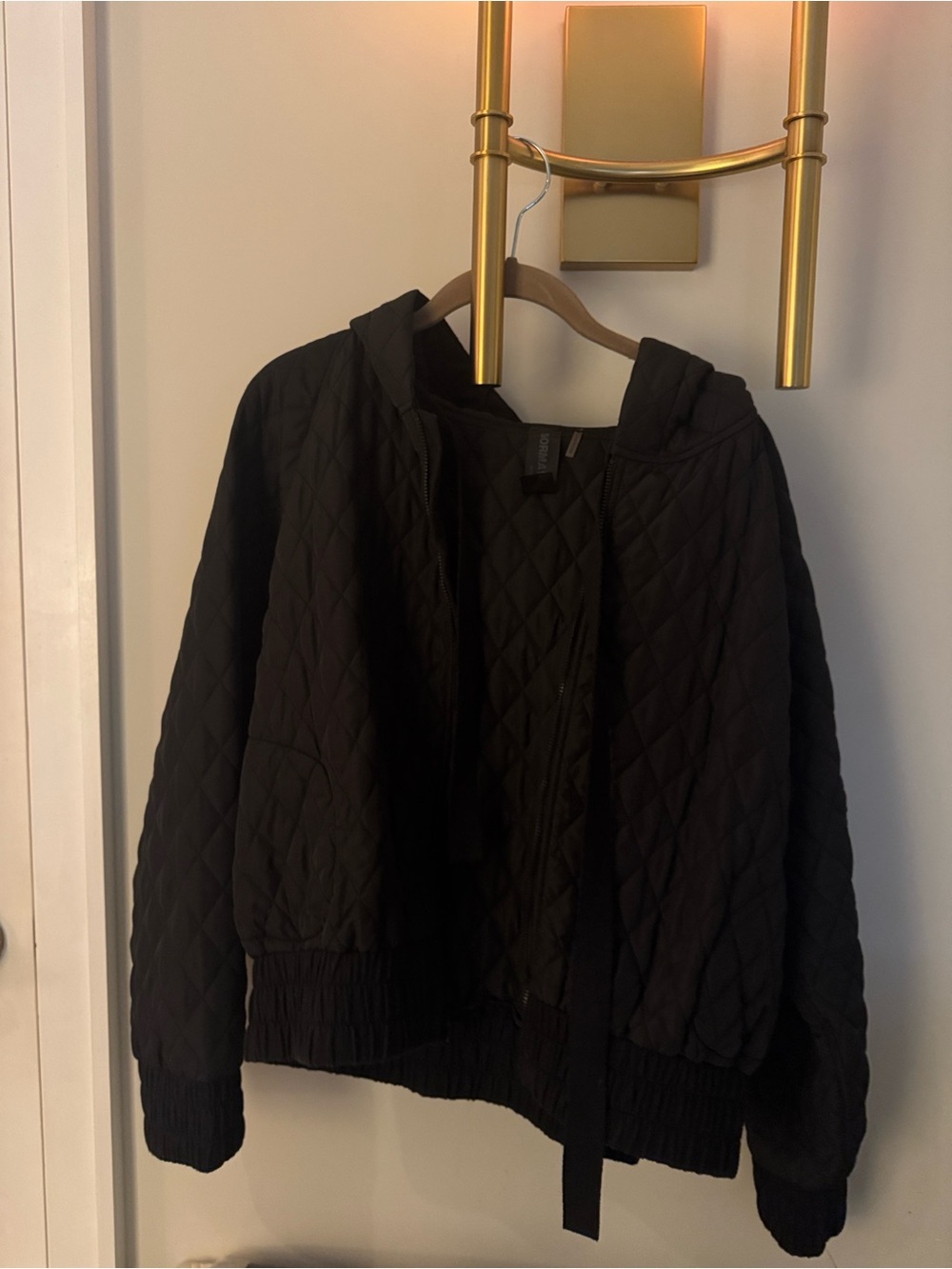 Norma Kamali black quilted jacket